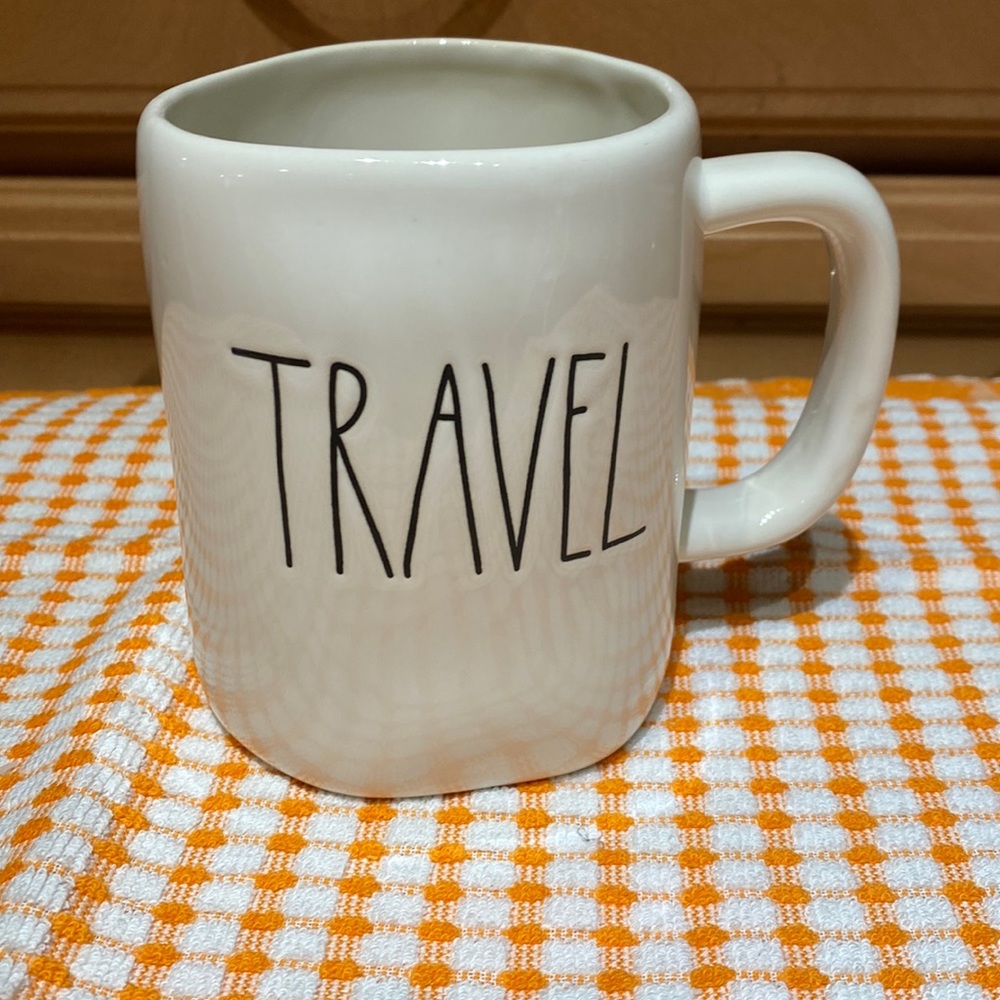 Rae Dunn mug with “travel” text